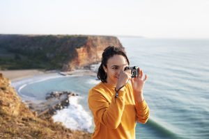 side-view-woman-taking-photos